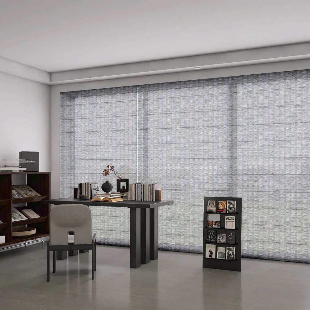 Roman shades in light-filtering mode in a study room.