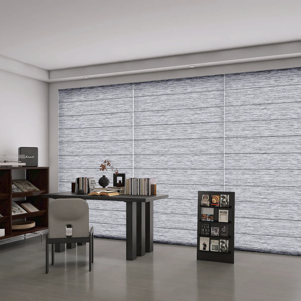 Roman shades fully closed for privacy in a study room.