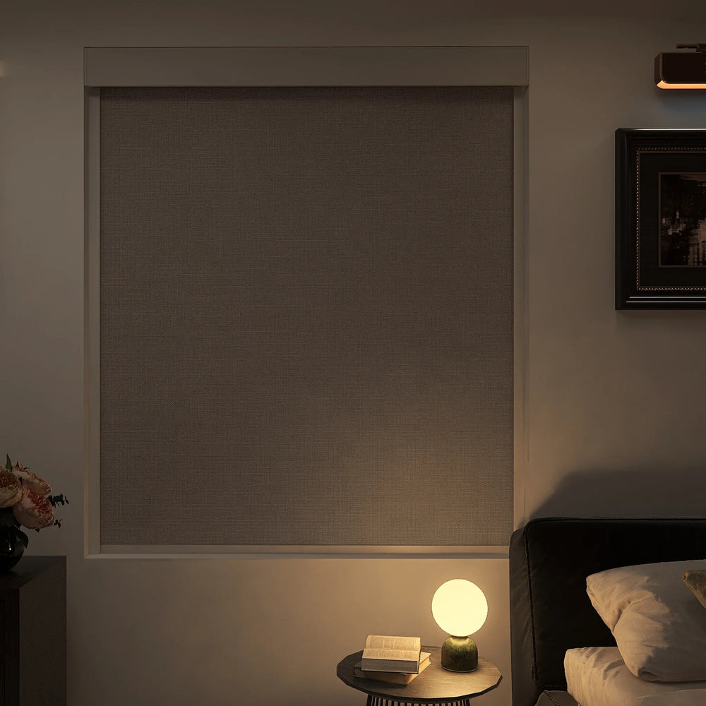 Motorized blackout roller shades fully closed for complete darkness
