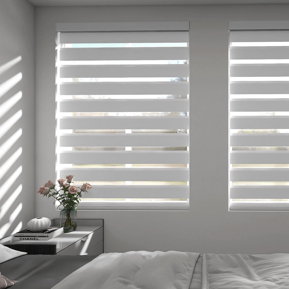 Light-filtering zebra shades in bedroom with soft daylight gently illuminating the space