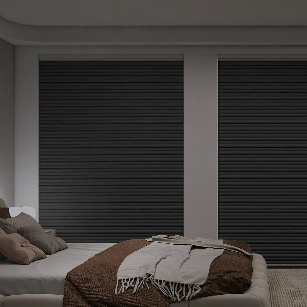 Blackout cellular shades fully closed in cozy bedroom