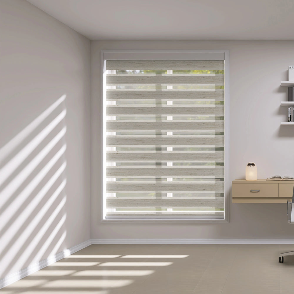 Home office with zebra shades in light-filtering mode allowing natural light