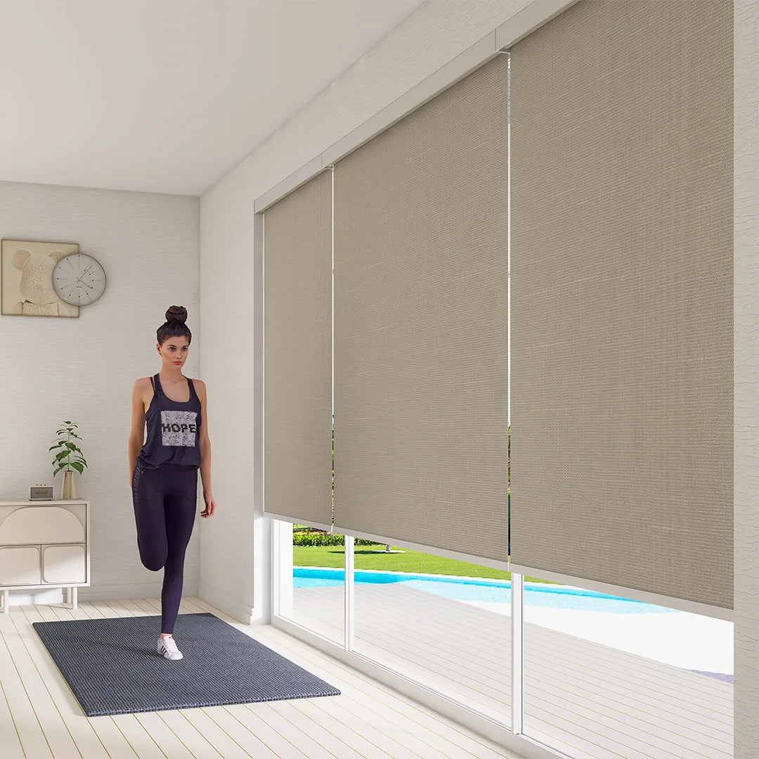 Motorized roller shades are perfect for controlling light in your home gym.