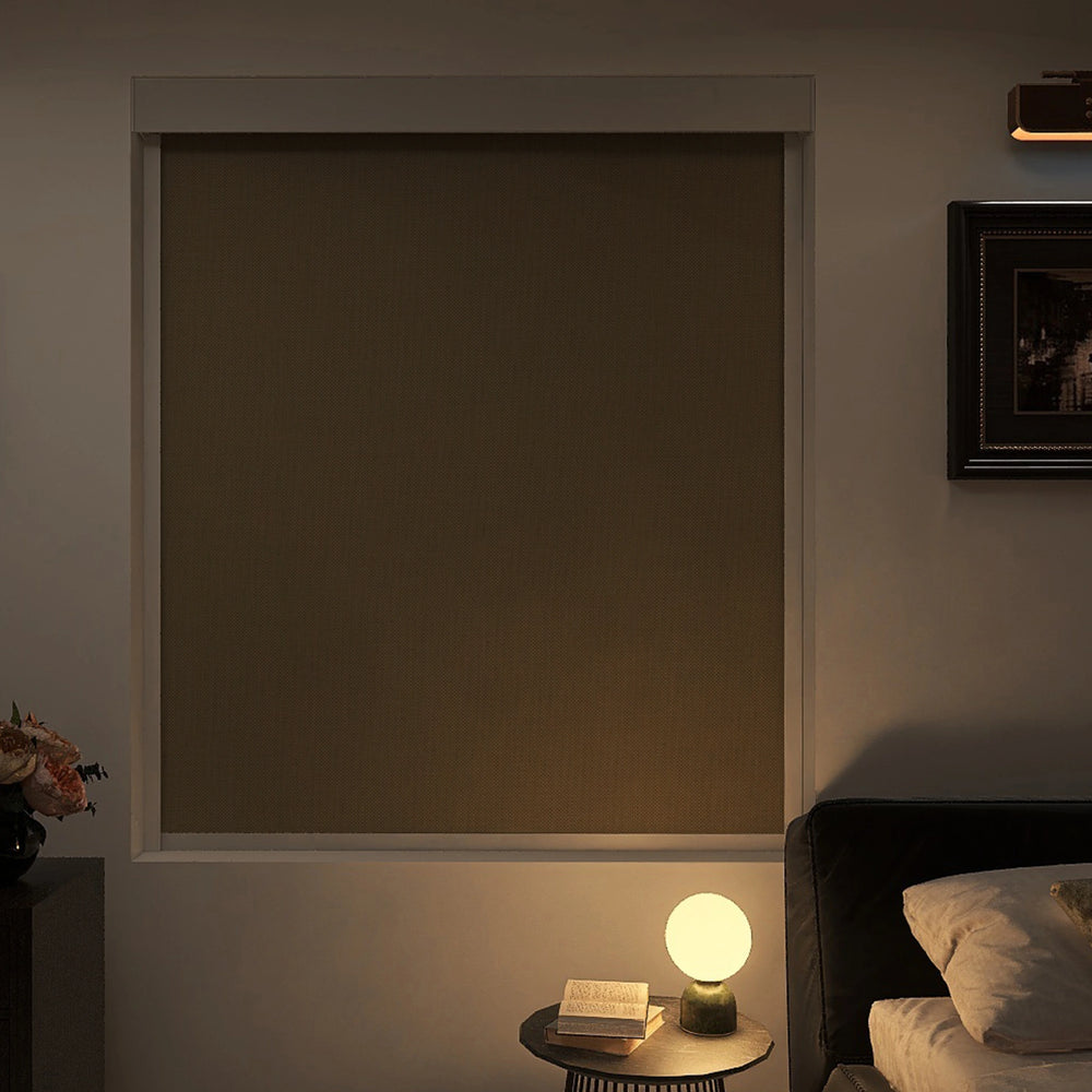Fully closed blackout roller shades in a peaceful bedroom